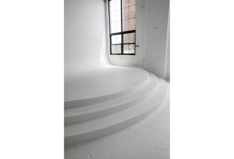 all white event space-min