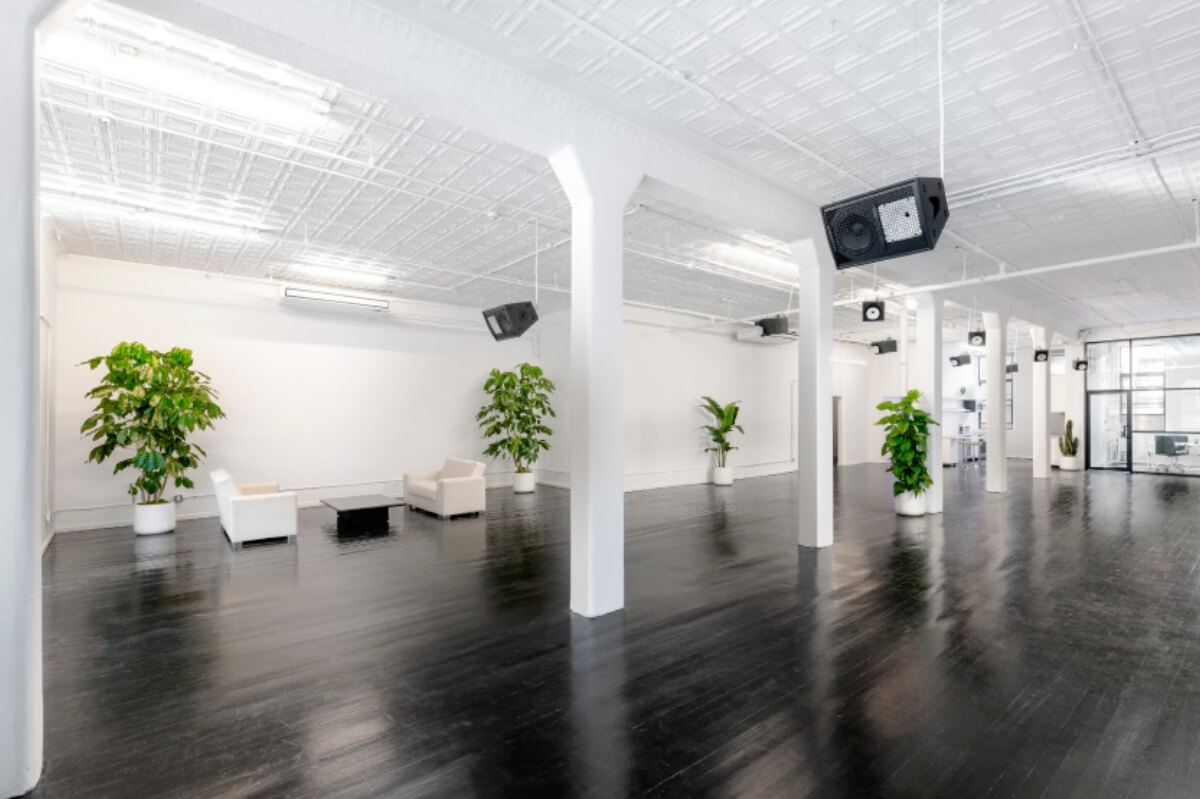 Artist Loft is double exposure loft event space located in Tribeca. This sleek, sprawling interior features dark polished wood floors, bright white walls, high ceilings, industrial columns, & numerous windows providing natural light. Ideal for private events or photo and video shoots complete with a glass office.