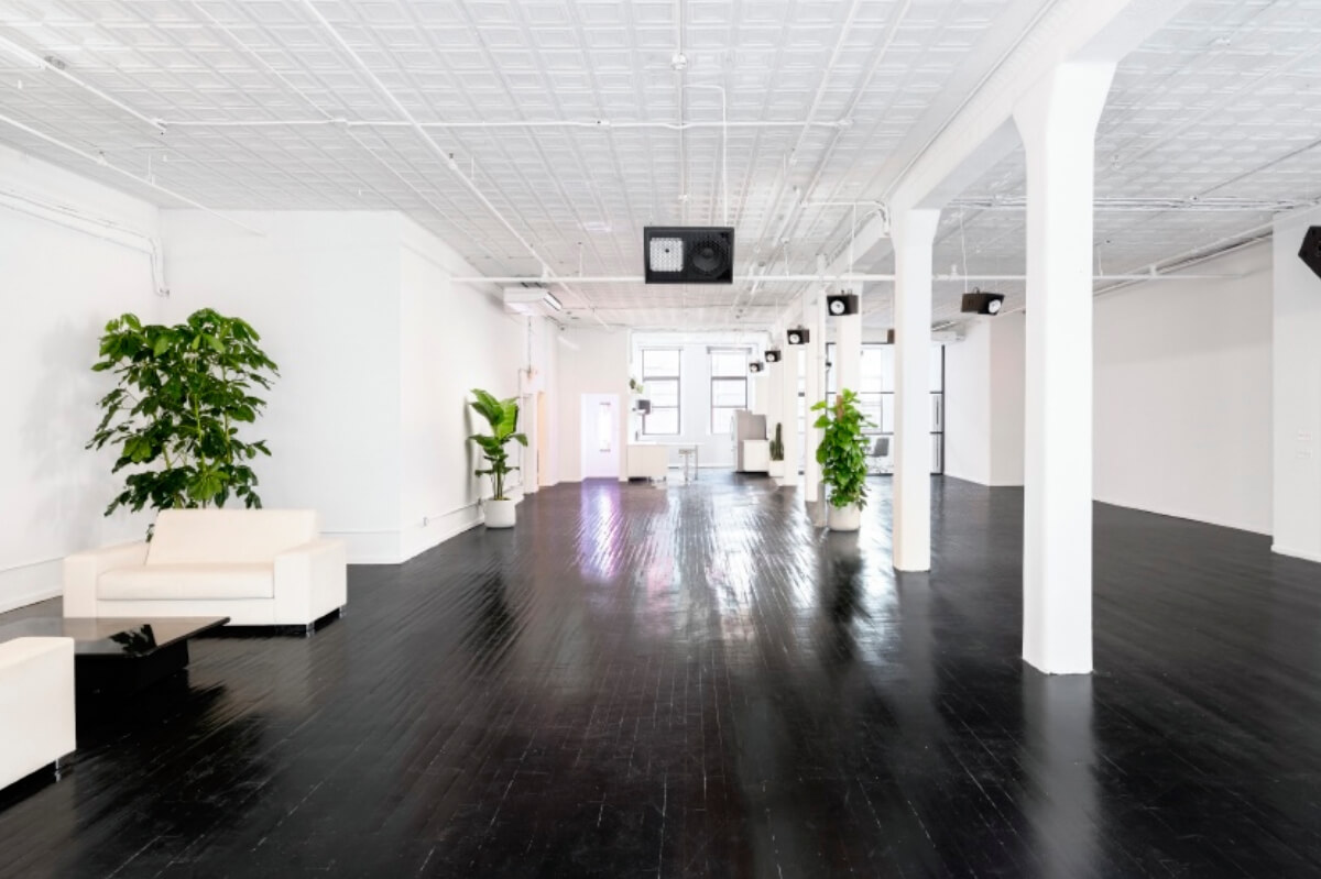 Artist Loft is double exposure loft event space located in Tribeca. This sleek, sprawling interior features dark polished wood floors, bright white walls, high ceilings, industrial columns, & numerous windows providing natural light. Ideal for private events or photo and video shoots complete with a glass office.